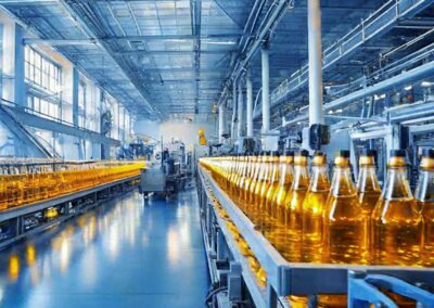 Robotic arms operating along a conveyor at ContainerFare